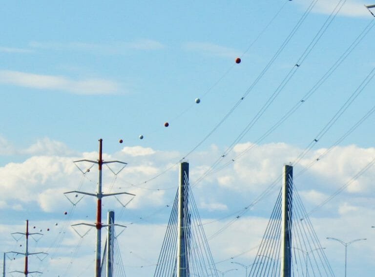 What are these spheres you can see on high voltage power lines?
