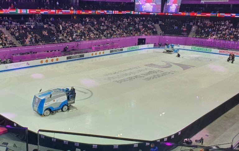 How thick is the ice in an arena ice rink?